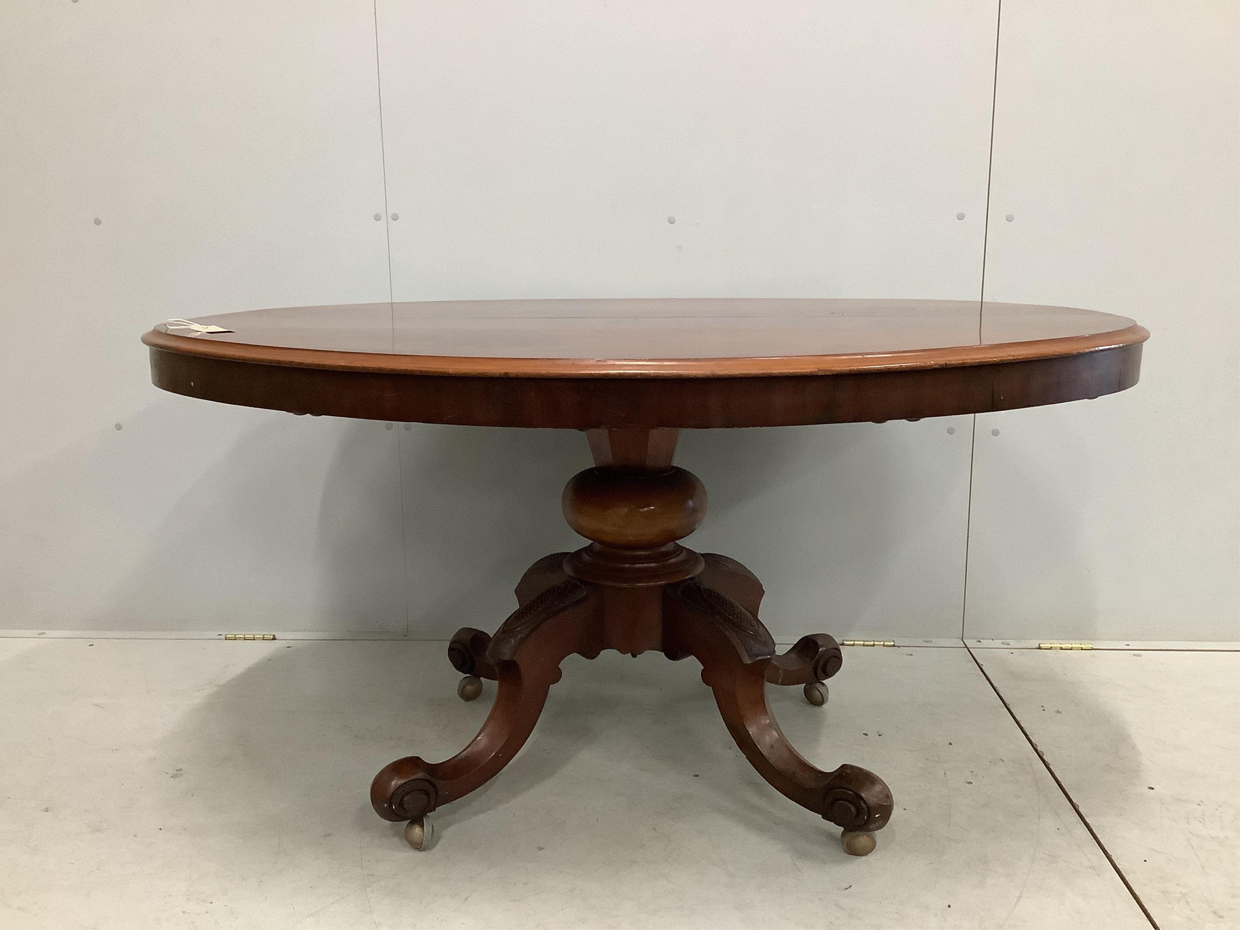 A Victorian oval mahogany tilt top loo table, diameter 146cm, depth 114cm, height 75cm. Condition - poor to fair